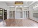 Bright living room features recessed lighting, built-in shelving, and hardwood floors at 2256 Kettle Dr, Orlando, FL 32835