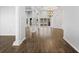 Open-concept living space with hardwood floors, decorative columns, and elegant lighting fixtures creating a sophisticated ambiance at 2256 Kettle Dr, Orlando, FL 32835
