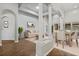 Bright living area features tray ceilings, white columns, and wood flooring at 2256 Kettle Dr, Orlando, FL 32835