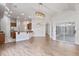 Open floor plan connects a dining area and kitchen, illuminated by modern lighting at 2256 Kettle Dr, Orlando, FL 32835