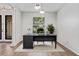 Cozy office area featuring a modern desk, chair, and ample natural light and tiled floors at 2256 Kettle Dr, Orlando, FL 32835
