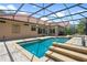 View of the screened in pool and patio area, showcasing the access to the home at 2256 Kettle Dr, Orlando, FL 32835