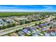 A great aerial view showing the location of the home with beautiful neighborhood landscape features at 235 Hidden Springs Cir, Kissimmee, FL 34743