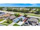 Aerial view of a cozy one-story home, with the pool area, and an appealing neighborhood at 235 Hidden Springs Cir, Kissimmee, FL 34743