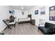 Well-lit bedroom with neutral walls, a ceiling fan, a mounted TV, and modern furnishings at 235 Hidden Springs Cir, Kissimmee, FL 34743