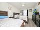 Bright bedroom with two beds, a ceiling fan, and a dresser with TV for relaxed living at 235 Hidden Springs Cir, Kissimmee, FL 34743