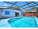 Spacious screened-in pool area with ample deck space for lounging and entertaining at 235 Hidden Springs Cir, Kissimmee, FL 34743
