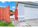 Crushed rock side yard and fenced area, with access to the backyard at 235 Hidden Springs Cir, Kissimmee, FL 34743