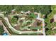 Aerial view of the community mini golf course surrounded by palm trees and lush landscaping at 255 Cordova Ave, Davenport, FL 33897