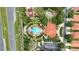 Aerial view of the community amenities featuring a pool, playground, mini golf, and tennis court at 255 Cordova Ave, Davenport, FL 33897