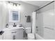 Bathroom with a white vanity and shower-tub combination, and modern fixtures at 255 Cordova Ave, Davenport, FL 33897