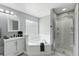 Inviting bathroom featuring a corner tub, glass-enclosed shower, and a vanity at 255 Cordova Ave, Davenport, FL 33897