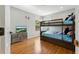 Charming bedroom with bunk beds, bright window, and fun decor at 255 Cordova Ave, Davenport, FL 33897