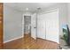 Open bedroom with a closet, open doorway, and laminate flooring at 255 Cordova Ave, Davenport, FL 33897