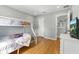 Bright bedroom featuring laminate wood flooring, bunkbed, and closet for ample storage at 255 Cordova Ave, Davenport, FL 33897