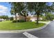 Charming single-Gathering home surrounded by beautiful mature trees and lush landscaping on a corner lot at 255 Cordova Ave, Davenport, FL 33897