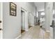 Inviting foyer leads to the living area and features decorative elements and natural light at 255 Cordova Ave, Davenport, FL 33897