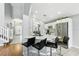 Bright kitchen with white cabinets, stainless steel appliances, bar seating, and an open layout at 255 Cordova Ave, Davenport, FL 33897