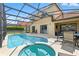 Expansive screened lanai with a private pool, spa, and plenty of space for entertaining at 255 Cordova Ave, Davenport, FL 33897