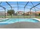 Private screened-in pool with sparkling water, perfect for relaxation and recreation at 255 Cordova Ave, Davenport, FL 33897