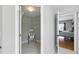 This walk-in closet boasts a marble-look floor and provides ample storage with built-in shelves at 255 Cordova Ave, Davenport, FL 33897