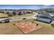 This aerial view features a playground in a well-maintained residential neighborhood at 2556 Volta Cir, Kissimmee, FL 34746