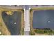 Aerial view of a bridge bisecting two ponds, showcasing the community's unique landscape at 2556 Volta Cir, Kissimmee, FL 34746
