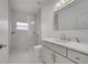 Beautiful bathroom features a walk-in shower, marble tiling and modern fixtures at 2556 Volta Cir, Kissimmee, FL 34746