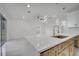 Living room boasts marble tile flooring, modern lighting and access to the outdoors at 2556 Volta Cir, Kissimmee, FL 34746