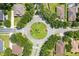 Aerial view of a quiet neighborhood roundabout surrounded by mature trees and well-kept homes at 2613 Breezy Meadow Rd, Apopka, FL 32712