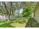 This backyard has a lush lawn and mature landscaping at 2613 Breezy Meadow Rd, Apopka, FL 32712