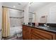This bathroom features a shower over tub and a double sink vanity at 2613 Breezy Meadow Rd, Apopka, FL 32712