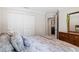 This bedroom features a closet and easy access to the laundry room at 2613 Breezy Meadow Rd, Apopka, FL 32712