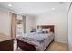 This bedroom features a comfy bed, curtains, and ample natural light at 2613 Breezy Meadow Rd, Apopka, FL 32712