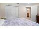Bedroom featuring a closet, ensuite bathroom, and carpeted floors at 2613 Breezy Meadow Rd, Apopka, FL 32712