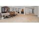 Spacious dining area featuring neutral carpet, bright windows, and elegant dining table with chairs at 2613 Breezy Meadow Rd, Apopka, FL 32712