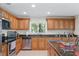 Well-equipped kitchen with granite counters, stainless steel appliances, and ample cabinet space at 2613 Breezy Meadow Rd, Apopka, FL 32712