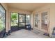 This covered lanai has a screen and door to the yard at 2613 Breezy Meadow Rd, Apopka, FL 32712