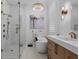 Stylish bathroom featuring a glass shower, soaking tub, double vanities and luxury fixtures at 2781 Stanfield Ave, Orlando, FL 32814
