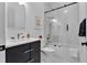Elegant bathroom featuring marble tile, glass shower door, and modern fixtures at 2781 Stanfield Ave, Orlando, FL 32814