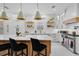 Modern kitchen featuring a large island, pendant lights, and stainless steel appliances at 2781 Stanfield Ave, Orlando, FL 32814