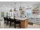 Bright, spacious kitchen with a large center island, pendant lighting, and modern appliances at 2781 Stanfield Ave, Orlando, FL 32814