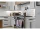 Close-up view of the kitchen with stainless steel range and white subway tile backsplash at 2781 Stanfield Ave, Orlando, FL 32814