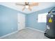Unfinished basement with tile flooring, water heater, and ceiling fan at 2918 E Central Blvd, Orlando, FL 32803