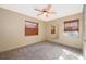Serene bedroom featuring soft carpeting, natural light, and a ceiling fan at 2918 E Central Blvd, Orlando, FL 32803