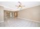 Open living area featuring tiled floors, a ceiling fan, and neutral-toned walls at 2918 E Central Blvd, Orlando, FL 32803