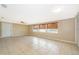 Spacious living room featuring tile floors, large windows and neutral wall color at 2918 E Central Blvd, Orlando, FL 32803