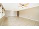 Spacious living room featuring tile floors, large windows, and multiple closets for storage at 2918 E Central Blvd, Orlando, FL 32803