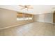 Spacious living room featuring tile floors, large windows and neutral wall color at 2918 E Central Blvd, Orlando, FL 32803