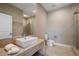 Modern bathroom with walk-in shower, vanity, and sleek fixtures at 3056 Rockefeller Way, Kissimmee, FL 34747